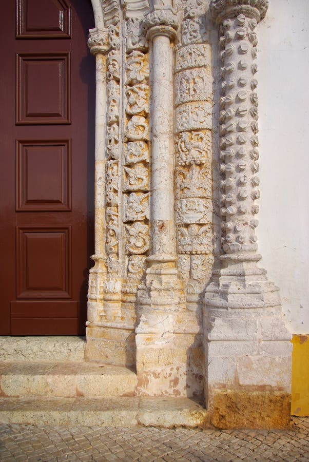 Stone Carvings. Old church door with Manueline style frame and rich ancient stone carvings artwork stock photography