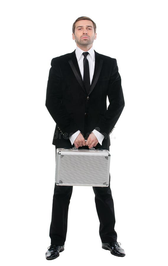 Stylish confident businessman with metal suitcase. Full-length. Isolated over white background stock image