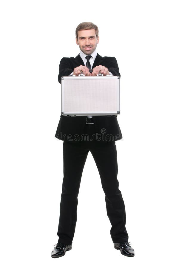 Stylish young businessman with metal suitcase. Full length. Isolated over white background stock image