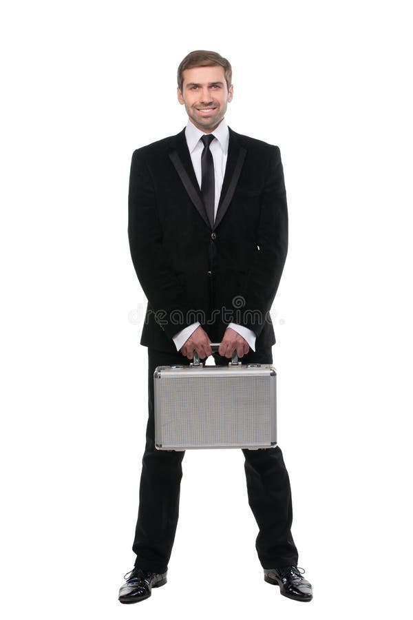 Stylish young businessman with metal suitcase. Full length. Isolated over white background royalty free stock images