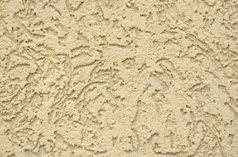 The texture of the beige decorative plaster in bark beetle style stock image