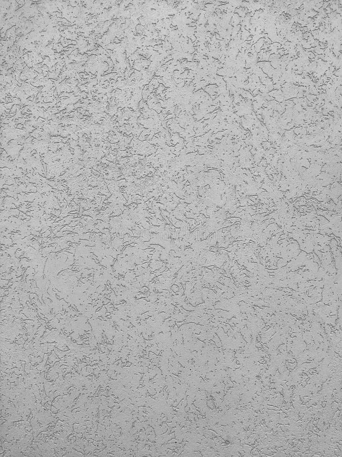 Texture of the grey plaster bark beetle on the wall. Seamless texture. The texture of the plaster is bark beetle on the wall. Seamless grey texture stock photography