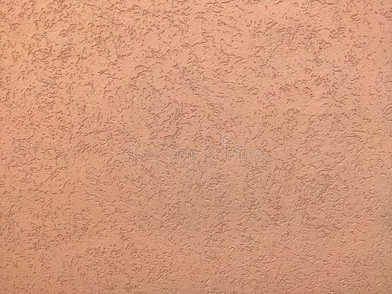 Texture of the pink plaster bark beetle on the wall. Seamless texture. The texture of the plaster is bark beetle on the wall. Seamless pink texture royalty free stock photography