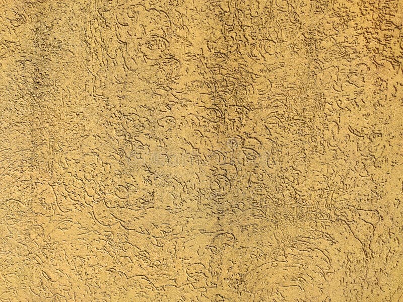 Texture of the yellow plaster bark beetle on the wall. Seamless texture. The texture of the plaster is bark beetle on the wall. Seamless yellow texture royalty free stock images