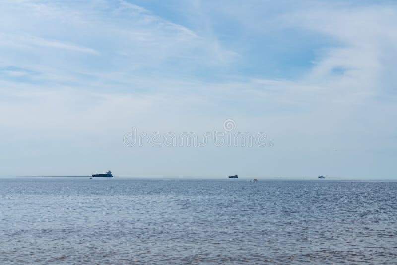 Three merchant ships to transport containers on Board at sea. cargo transportation. And logistics stock photo