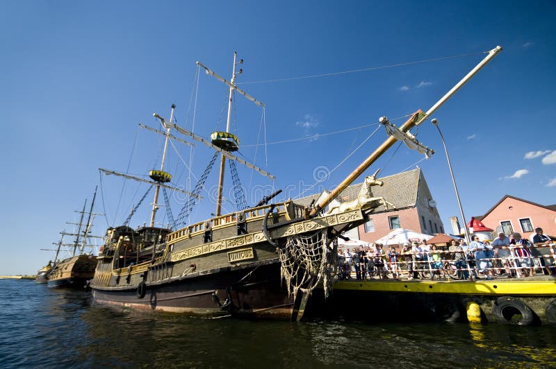 Vintage ships in port. Short sea trips on board of vintage sailing ships are great touristic attraction for people visiting Darlowo, Poland, the Baltic Sea stock photos