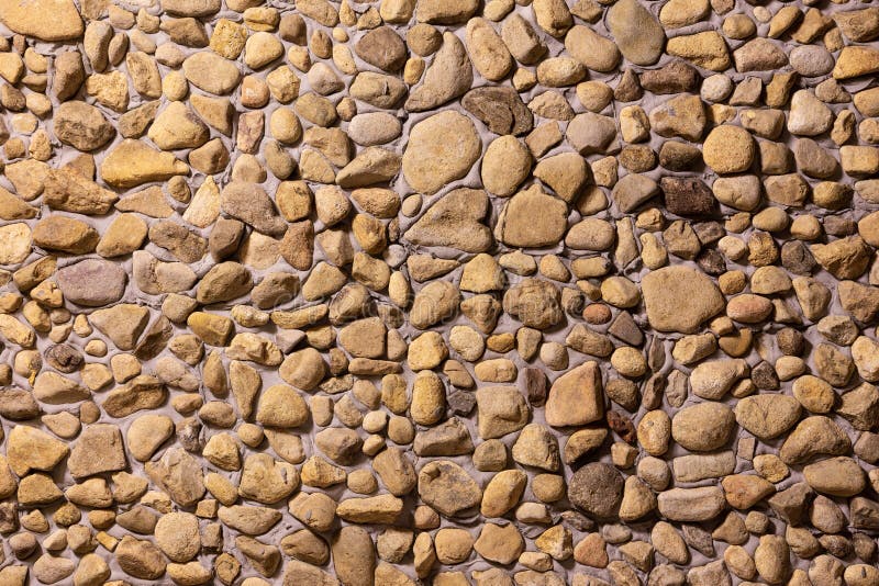 Wall decorated with stone, for background or texture, closeup wall built with natural stone, beautiful pattern and modern style royalty free stock photos