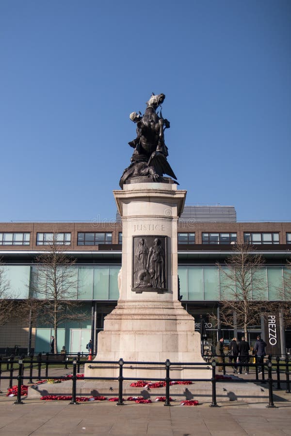 War Memorial bronze statue on stone plinth with poppy wreaths in Old Eldon Square Newcastle upon Tyne. Newcastle / Great Britain : War Memorial bronze statue on royalty free stock image