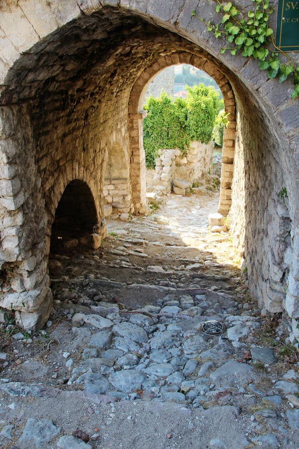 Secret passage in the wall of the medieval fortress in the city of Bar, Montenegro. stock photo