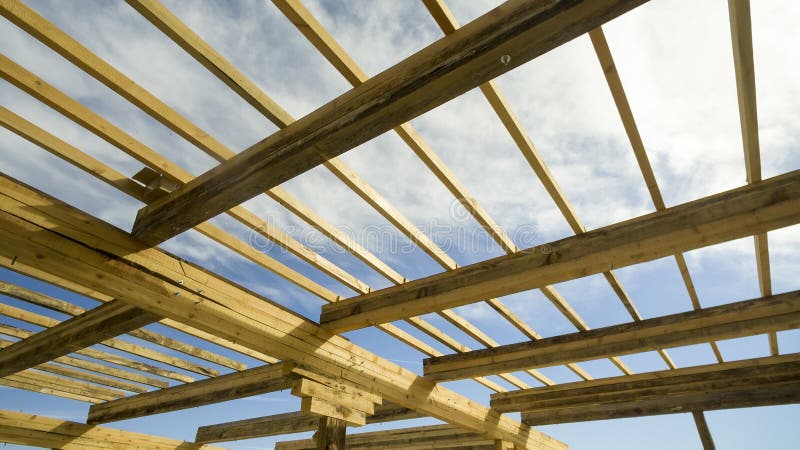 Wooden beams at construction the roof of house stock photography