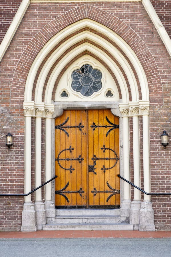 Wooden entrance door of church stock image