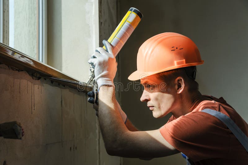 Worker is using a polyurethane foam. royalty free stock photos