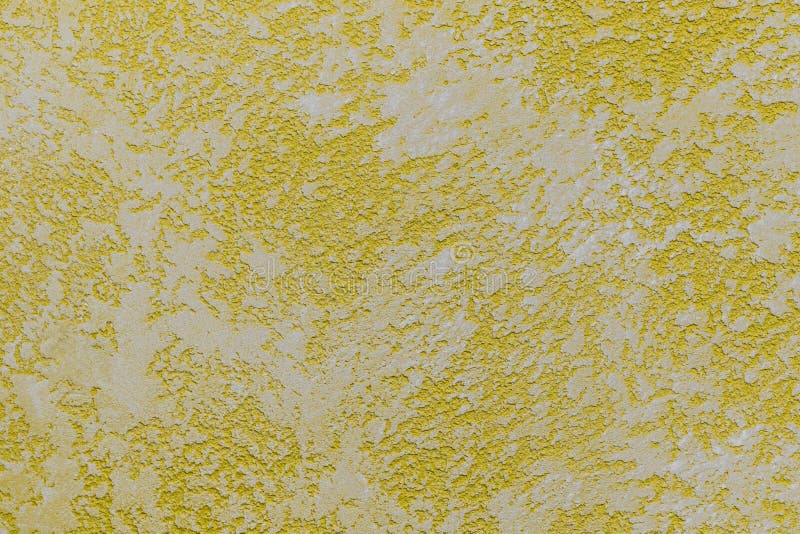 Yellow plaster wall texture. Textured background stock photography
