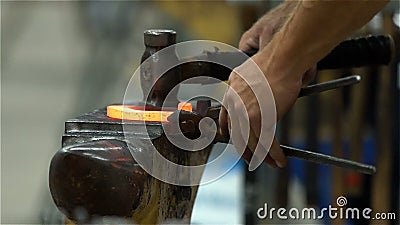 Blacksmith forges a horseshoe. Slow motion stock video