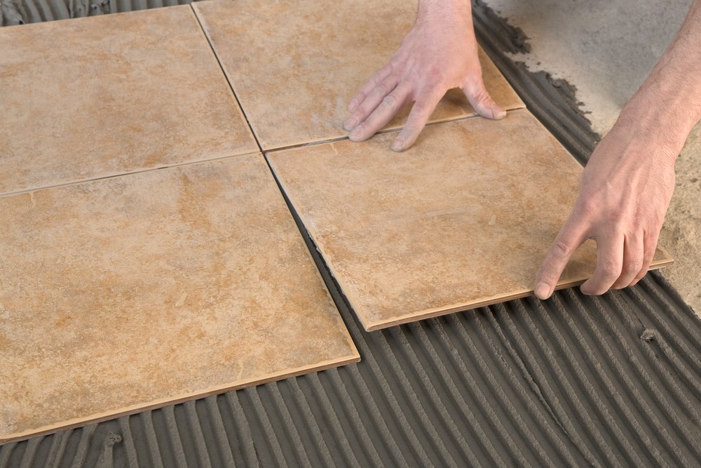 how to lay tile in your own hands